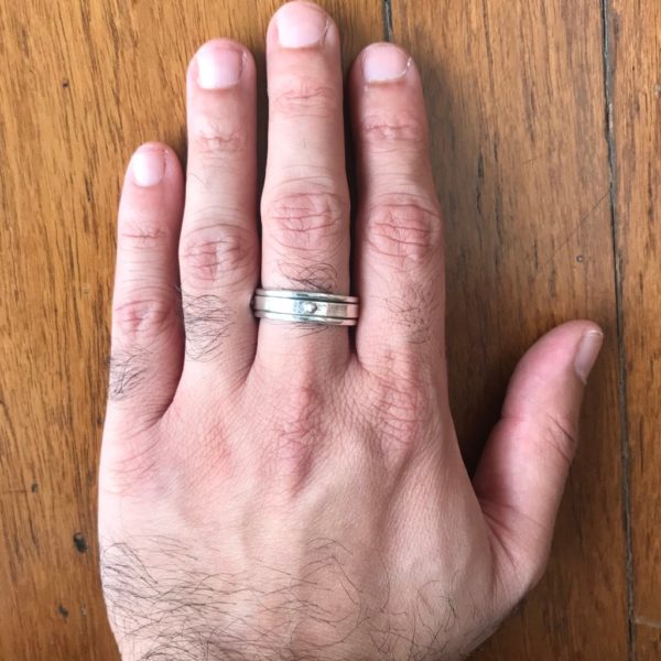 model wearing sterling silver meditation ring for men & women