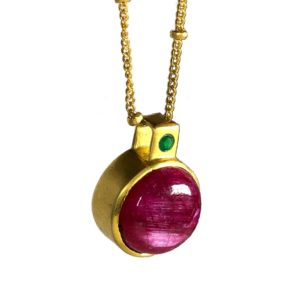 side view of gemstone set sterling silver pendant and chain
