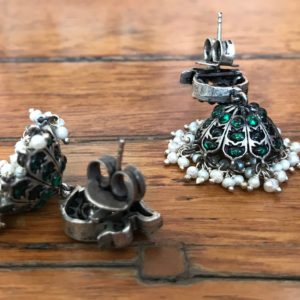 sterling silver jhumka earrings in jadau style with green stone