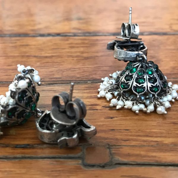 sterling silver jhumka earrings in jadau style with green stone